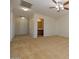 Large bedroom with a ceiling fan, neutral walls, and multiple doorways at 14552 W Hearn Rd, Surprise, AZ 85379