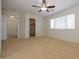 Inviting bedroom with ceiling fan, natural light, and walk-in closet at 14552 W Hearn Rd, Surprise, AZ 85379