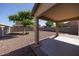 An empty covered patio, perfect for sitting outside at 14552 W Hearn Rd, Surprise, AZ 85379