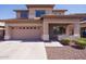 Charming two-story home featuring a two-car garage and well-maintained landscaping in a desirable neighborhood at 14552 W Hearn Rd, Surprise, AZ 85379