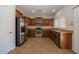 Bright kitchen featuring stainless steel appliances and tan countertops at 14552 W Hearn Rd, Surprise, AZ 85379