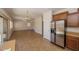 View from the kitchen, showing stainless steel refrigerator and dining space at 14552 W Hearn Rd, Surprise, AZ 85379