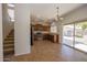 Open kitchen view near stairs, showcasing stainless steel appliances and ample cabinet space at 14552 W Hearn Rd, Surprise, AZ 85379