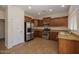 The kitchen showcases stainless steel appliances and ample cabinet space at 14552 W Hearn Rd, Surprise, AZ 85379
