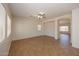 Spacious living area with neutral walls, tile flooring, and open layout perfect for entertaining at 14552 W Hearn Rd, Surprise, AZ 85379