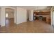 Open floor plan connecting the living room and kitchen, ideal for modern living and entertaining at 14552 W Hearn Rd, Surprise, AZ 85379