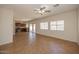 Bright living room features neutral walls, tile flooring, and sliding doors to a private outdoor area at 14552 W Hearn Rd, Surprise, AZ 85379