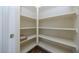 A white pantry with multiple shelves for food storage at 14552 W Hearn Rd, Surprise, AZ 85379