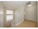 Well-lit upstairs landing with stairs and natural light from the window at 14552 W Hearn Rd, Surprise, AZ 85379