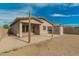 Spacious backyard with a covered patio, storage shed, and plenty of room for outdoor activities at 15134 N 138Th Ln, Surprise, AZ 85379