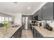 Spacious kitchen with stainless steel appliances, granite countertops, a large island, and ample cabinet space at 15134 N 138Th Ln, Surprise, AZ 85379