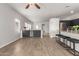 Open living space featuring a kitchen island and barstool seating at 15134 N 138Th Ln, Surprise, AZ 85379