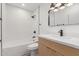 Chic bathroom design featuring a bathtub and light wood vanity at 1633 E Beverly Ln, Phoenix, AZ 85022