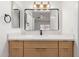 New bathroom with a quartz counter top, modern light fixtures, and dark hardware at 1633 E Beverly Ln, Phoenix, AZ 85022