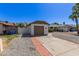 This home features a single-car garage with driveway and low maintenance rock landscaping at 1633 E Beverly Ln, Phoenix, AZ 85022