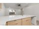The kitchen features a waterfall island, stainless steel faucet and breakfast bar at 1633 E Beverly Ln, Phoenix, AZ 85022
