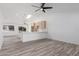 Bright kitchen with stainless steel appliances, breakfast bar, and wood look tile at 1633 E Beverly Ln, Phoenix, AZ 85022