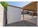 The back yard has a storage shed, covered patio and low-maintenance desert landscaping with a white rock ground cover at 1633 E Beverly Ln, Phoenix, AZ 85022