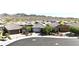 Stunning aerial view of a well-maintained neighborhood with mountain views at 16521 W Magdalena Ln, Goodyear, AZ 85338