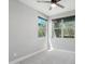 Bright bedroom with plush carpet, neutral walls, and large windows offering ample natural light at 16521 W Magdalena Ln, Goodyear, AZ 85338