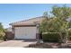 Attractive single-story home with a tile roof and well-manicured landscaping, enhancing curb appeal at 16521 W Magdalena Ln, Goodyear, AZ 85338