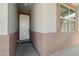 Inviting covered porch featuring neutral tones and a welcoming front door at 16521 W Magdalena Ln, Goodyear, AZ 85338