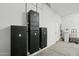 This garage features electrical components, a utility sink, and an automatic water heater at 16521 W Magdalena Ln, Goodyear, AZ 85338