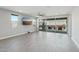 The open living room leads to a sliding glass doors, extending the living space to a backyard at 16521 W Magdalena Ln, Goodyear, AZ 85338