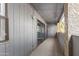 Outdoor patio with gray wood paneling, stucco pillars, and string lights at 1730 W Emelita Ave # 2027, Mesa, AZ 85202
