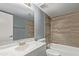 Bright bathroom featuring a shower over bath with horizontally laid wood-look tiles at 1730 W Emelita Ave # 2027, Mesa, AZ 85202