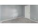 This bedroom has carpet, neutral paint, and a door to the hallway at 1730 W Emelita Ave # 2027, Mesa, AZ 85202