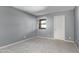 This bedroom has carpet, neutral paint, and a window at 1730 W Emelita Ave # 2027, Mesa, AZ 85202