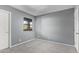 This bedroom has carpet, neutral paint, and a window at 1730 W Emelita Ave # 2027, Mesa, AZ 85202
