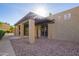 Exterior of the clubhouse with desert landscaping, shade covering, and stucco pillars at 1730 W Emelita Ave # 2027, Mesa, AZ 85202