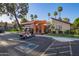Exterior shot of entrance area with a golf cart parked in the foreground at 1730 W Emelita Ave # 2027, Mesa, AZ 85202