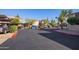 Apartment complex exterior with covered parking and desert landscaping at 1730 W Emelita Ave # 2027, Mesa, AZ 85202