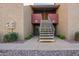 Exterior stairs leading to upper-level apartment homes with desert landscaping at 1730 W Emelita Ave # 2027, Mesa, AZ 85202