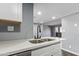 This kitchen has a stainless steel sink with a sleek black faucet at 1730 W Emelita Ave # 2027, Mesa, AZ 85202