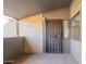 Private patio with secure entry door and textured walls at 1730 W Emelita Ave # 2027, Mesa, AZ 85202