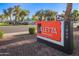 Exterior sign for Villetta Apartment Homes near a sidewalk and street at 1730 W Emelita Ave # 2027, Mesa, AZ 85202