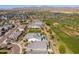 Stunning aerial view of the community featuring beautiful homes, green spaces, and mountain views in the distance at 17362 W Wildwood St, Surprise, AZ 85388