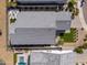 A bird's-eye view of a property featuring a neatly arranged backyard, patio, pool, and landscaped surroundings at 17362 W Wildwood St, Surprise, AZ 85388