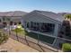 Aerial view of a home with a well-designed backyard, including an outdoor kitchen and inviting seating areas at 17362 W Wildwood St, Surprise, AZ 85388