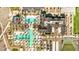 Stunning aerial view of a community pool and clubhouse surrounded by lush landscaping and palm trees at 17362 W Wildwood St, Surprise, AZ 85388