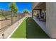 Backyard with putting green, patio, and view of the golf course at 17362 W Wildwood St, Surprise, AZ 85388