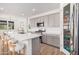 Modern kitchen with stainless steel appliances, a center island with seating, and ample cabinet space at 17362 W Wildwood St, Surprise, AZ 85388