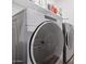 Laundry Room with large washer and dryer set with shelf above at 17362 W Wildwood St, Surprise, AZ 85388