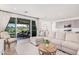 Inviting living room with a large sectional sofa, sliding glass doors to the patio, and an open-concept design at 17362 W Wildwood St, Surprise, AZ 85388