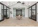 Spacious lobby featuring a large round table, elegant lighting, and stylish decor at 17362 W Wildwood St, Surprise, AZ 85388