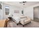 Bright main bedroom offers ample natural light, wood-look floors, and neutral decor for a calming retreat at 17362 W Wildwood St, Surprise, AZ 85388